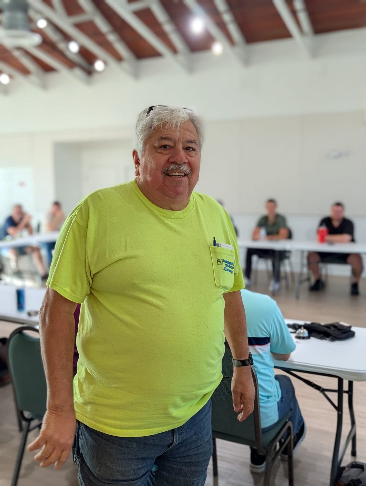 A workshop attendee standing in the room