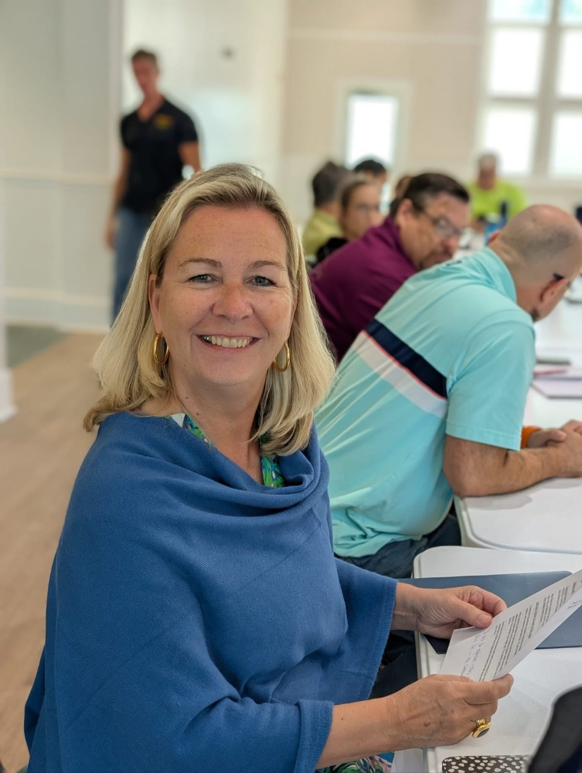 A workshop attendee smiling